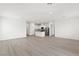 Expansive living room featuring an open floor plan connecting to the kitchen, perfect for modern living at 2733 Avril Point St, Las Vegas, NV 89156