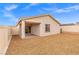 A cozy covered patio in a low-maintenance backyard with a gravel groundcover, perfect for outdoor relaxation at 2739 Avril Point St, Las Vegas, NV 89156