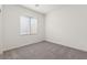 Small bedroom showcasing soft carpet, white walls, and a bright window at 2739 Avril Point St, Las Vegas, NV 89156