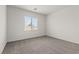 Simple bedroom design with neutral carpet and a bright window at 2739 Avril Point St, Las Vegas, NV 89156