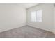 Bedroom showcasing soft carpet, white walls, and a bright window at 2739 Avril Point St, Las Vegas, NV 89156