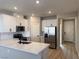 Modern kitchen features white cabinets, stainless steel appliances, and marble countertops at 3212 Walker River St, North Las Vegas, NV 89032
