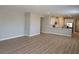 Bright, open-concept living area with hardwood flooring and recessed lighting at 3212 Walker River St, North Las Vegas, NV 89032