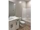 Clean bathroom featuring a white vanity with quartz countertop, a tub-shower, and modern fixtures at 3240 Lahontan St, North Las Vegas, NV 89032