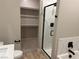 Contemporary bathroom with a glass-enclosed shower, a walk-in closet, and modern fixtures at 3240 Lahontan St, North Las Vegas, NV 89032