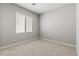 Cozy bedroom with neutral carpet, a window, and ample natural light at 3240 Lahontan St, North Las Vegas, NV 89032