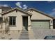 Charming single-story home with a two-car garage, desert landscaping, and a welcoming entryway at 3240 Lahontan St, North Las Vegas, NV 89032