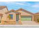Charming single-story home featuring a well-manicured yard and a two-car garage at 3240 Lahontan St, North Las Vegas, NV 89032