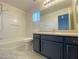Bathroom featuring a shower/tub, mirror, vanity, and neutral walls at 3311 Fico Ave, Las Vegas, NV 89141