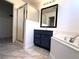 Bathroom featuring a glass-enclosed shower, soaking tub and a large mirror at 3311 Fico Ave, Las Vegas, NV 89141