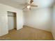 Bedroom featuring a closet, ceiling fan, neutral walls, and carpet flooring at 3311 Fico Ave, Las Vegas, NV 89141