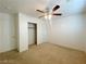 Bedroom with a closet, ceiling fan, neutral walls, and carpet flooring at 3311 Fico Ave, Las Vegas, NV 89141