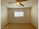 Bedroom featuring a single window, ceiling fan, neutral walls, and carpet flooring at 3311 Fico Ave, Las Vegas, NV 89141