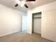 Bedroom with neutral carpet, ceiling fan and closet with folding doors at 3311 Fico Ave, Las Vegas, NV 89141