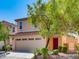 Charming two-story home featuring a two-car garage and a red front door at 3311 Fico Ave, Las Vegas, NV 89141