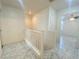 Upstairs hallway featuring white railings and tile floors at 3311 Fico Ave, Las Vegas, NV 89141