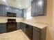 Kitchen boasts painted cabinets, modern appliances, and light countertops at 3311 Fico Ave, Las Vegas, NV 89141
