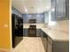 Kitchen featuring painted cabinets and black appliances at 3311 Fico Ave, Las Vegas, NV 89141