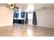 Open-concept living area flowing into kitchen with navy blue cabinetry and tile flooring at 3311 Fico Ave, Las Vegas, NV 89141