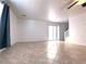 Bright living room featuring tile flooring and sliding glass door access to outdoor area at 3311 Fico Ave, Las Vegas, NV 89141
