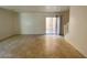 Bright living area with tiled floor and sliding glass doors to the outside at 3311 Fico Ave, Las Vegas, NV 89141