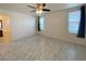Spacious main bedroom features tile flooring, ceiling fan, and ample natural light at 3311 Fico Ave, Las Vegas, NV 89141
