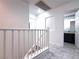 Upstairs hallway featuring stylish tile flooring, white walls, and view of bathroom at 3311 Fico Ave, Las Vegas, NV 89141