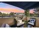 Relaxing balcony view with comfortable seating and a picturesque sunset backdrop at 3425 E Russell Rd # 202, Las Vegas, NV 89120