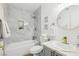 Updated bathroom with shower and tub, gray cabinets, marble accents, and modern gold hardware at 3425 E Russell Rd # 202, Las Vegas, NV 89120