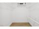 Spacious walk-in closet with white wire shelving and hardwood floors at 3425 E Russell Rd # 202, Las Vegas, NV 89120