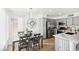 Bright dining area with modern table set and view to the updated kitchen and stainless steel appliances at 3425 E Russell Rd # 202, Las Vegas, NV 89120
