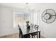 Bright dining room featuring modern light fixture, and accent clock on a clean wall at 3425 E Russell Rd # 202, Las Vegas, NV 89120