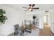 Bright home office with fan, desk, shelving, and sliding mirrored closet featuring wood flooring at 3425 E Russell Rd # 202, Las Vegas, NV 89120