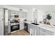 Modern kitchen with stainless steel appliances, marble countertops, and ample cabinet space at 3425 E Russell Rd # 202, Las Vegas, NV 89120