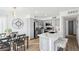 Updated kitchen with breakfast bar, stainless appliances, gray cabinetry, and eat-in dining space at 3425 E Russell Rd # 202, Las Vegas, NV 89120