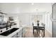 Open kitchen and dining area with marble countertops and direct views of the living room at 3425 E Russell Rd # 202, Las Vegas, NV 89120