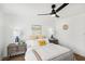 Inviting main bedroom with ceiling fan, two nightstands, and decor art on wall at 3425 E Russell Rd # 202, Las Vegas, NV 89120