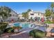 Community pool area featuring well-manicured landscaping and comfortable seating options at 3425 E Russell Rd # 202, Las Vegas, NV 89120