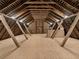 Large attic featuring wooden beams and flooring offering endless possibilities for customization at 3455 Five Pennies Ln, Las Vegas, NV 89120