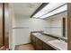 Bathroom with double sinks, large mirror, and tile flooring at 3455 Five Pennies Ln, Las Vegas, NV 89120