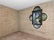 Bedroom with a unique window and brick walls at 3455 Five Pennies Ln, Las Vegas, NV 89120