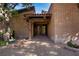 Inviting front entrance with a wooden pergola and beautifully crafted double doors at 3455 Five Pennies Ln, Las Vegas, NV 89120