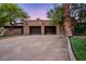 Attached two-car garage featuring mature trees and landscaping at 3455 Five Pennies Ln, Las Vegas, NV 89120
