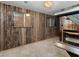 An interior room with wood paneled walls and access to another room at 3455 Five Pennies Ln, Las Vegas, NV 89120