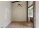 Cozy living room featuring tile floors, exposed beams, and natural light at 3455 Five Pennies Ln, Las Vegas, NV 89120