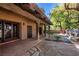 Covered patio featuring brick walls, wooden beams, and outdoor fountain at 3455 Five Pennies Ln, Las Vegas, NV 89120
