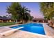 Backyard swimming pool with diving board and mature landscaping, perfect for hot summer days at 3455 Five Pennies Ln, Las Vegas, NV 89120