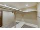 Bright walk-in closet featuring custom shelving and tile flooring at 3455 Five Pennies Ln, Las Vegas, NV 89120