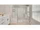 Modern bathroom features a walk-in shower, double sink vanity, and stylish fixtures at 3514 Punta Tersiva Ln, Henderson, NV 89044