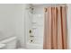 Clean bathroom shows tile floor, toilet, and bathtub with bronze fixtures at 3514 Punta Tersiva Ln, Henderson, NV 89044